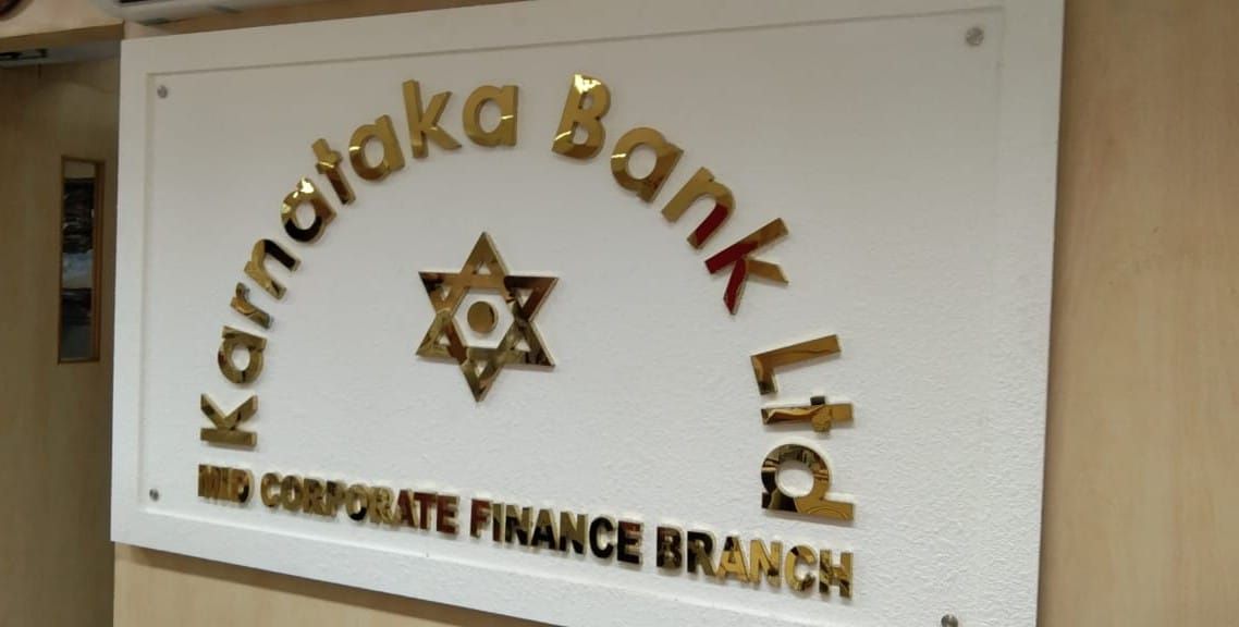 Golden acrylic 3D letters on an office wall
